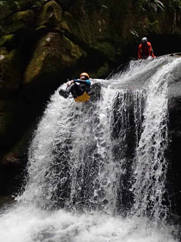 Traveller jumping down a waterfall