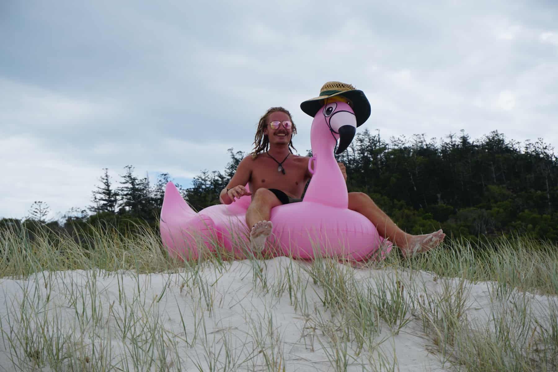 A man on a pink flamingo